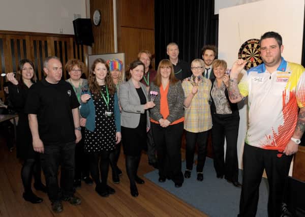 Kesteven and Sleaford High School staff playing darts for Sport Relief, with PDC darts champion Jason Marriott. EMN-160323-153410001