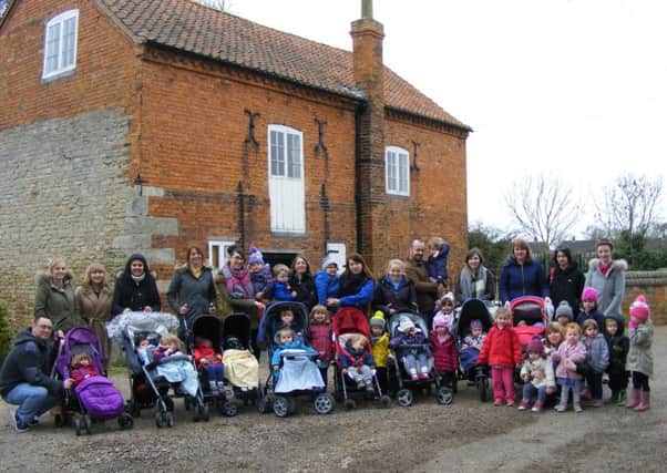Eslaforde Nursery staff, children and parents reach Cogglesford mill on their sponsored walk. EMN-160325-131229001