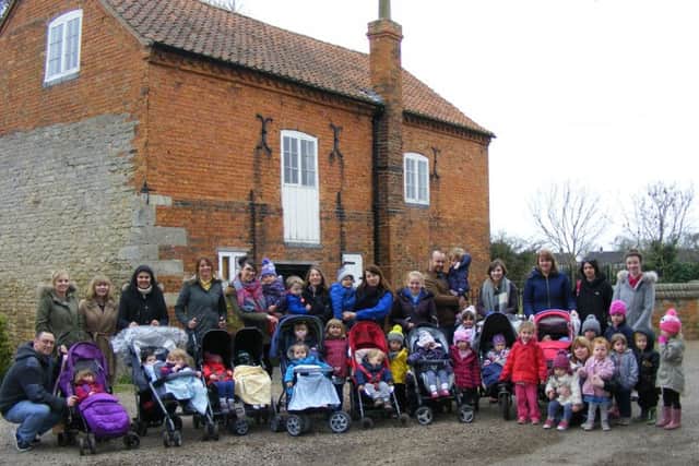 Eslaforde Nursery staff, children and parents reach Cogglesford mill on their sponsored walk. EMN-160325-131229001