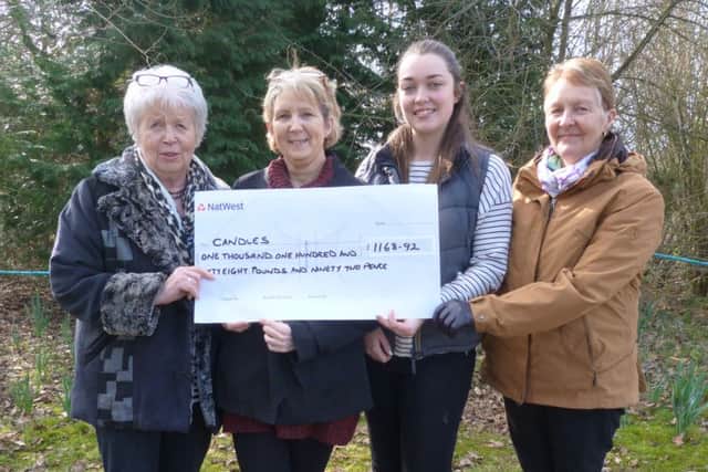 Holding the chequeare, from left, Pam Connock, Mel Jacob and two of the competitors in the shoot, Victoria Brant and Sue Froggatt. (Lin) EMN-160329-131713001