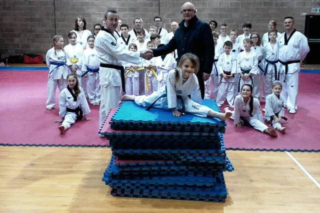 Stuart Cropley, from Cropleys Suzuki, Master Alan Steeper and members of Boston Taekwondo.