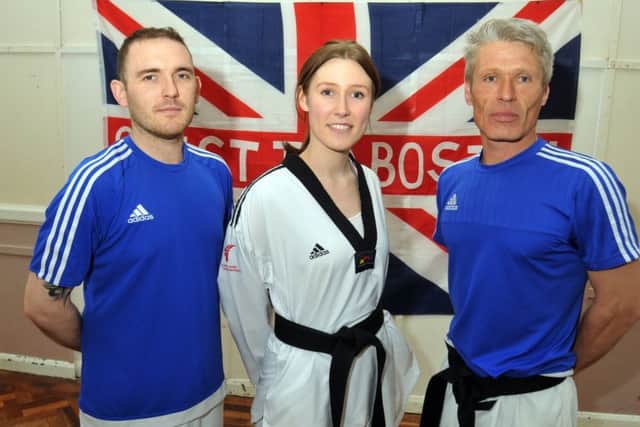 Megan Featherstone with dad and coach Jason Featherstone (right) and fellow coach Michael Reilly. Photo by Tim Wilson.
