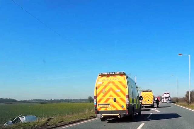 Emergency services at the crash scene on the A17 this morning. Photo by Ted Clark. EMN-160331-165142001
