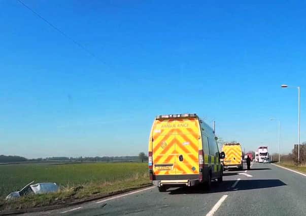 Emergency services at the crash scene on the A17 this morning. Photo by Ted Clark. EMN-160331-165142001