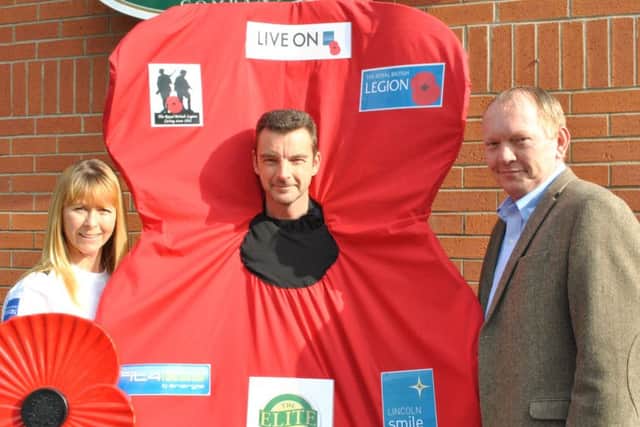 David and Michaela Moulds, with The Elite Fish & Chip Companys Adrian Tweedale. EMN-160704-130501001