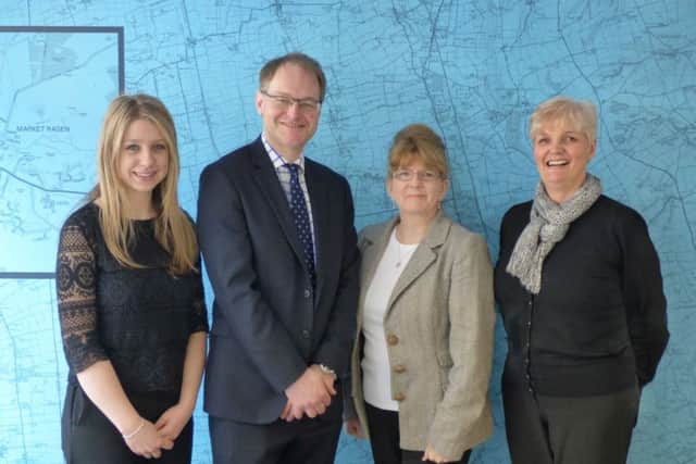 John Taylors director Robert Laverack with staff of the Market Rasen office. EMN-160404-134630001