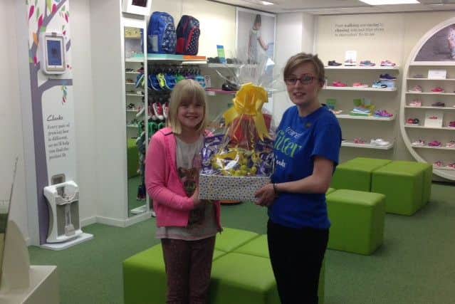 Emily Rastall, age 8, received her Easter prize from Sophie Brignall, one of the sales assistants at Clarks in Louth.