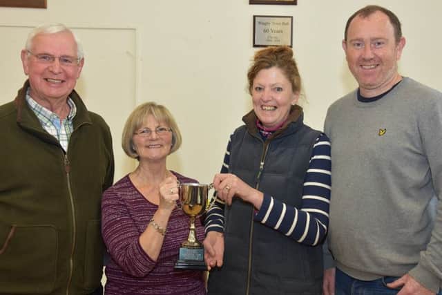 Trophy winners Edith Nash and Clare Lee,with John Bird Gardening Club Chairman and Alan Watson of Green Thumb Lawn Treatment Services who sponsored the show.
Photo John Edwards. EMN-160604-070856001
