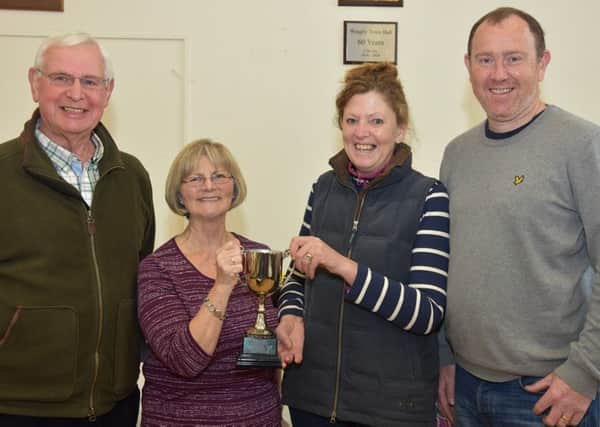 Trophy winners Edith Nash and Clare Lee,with John Bird Gardening Club Chairman and Alan Watson of Green Thumb Lawn Treatment Services who sponsored the show.
Photo John Edwards. EMN-160604-070856001