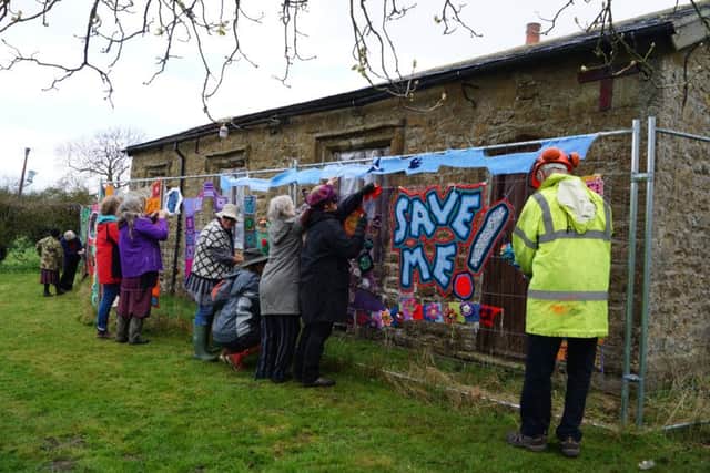 Yarn bombing at Legsby Old School EMN-161204-112749001