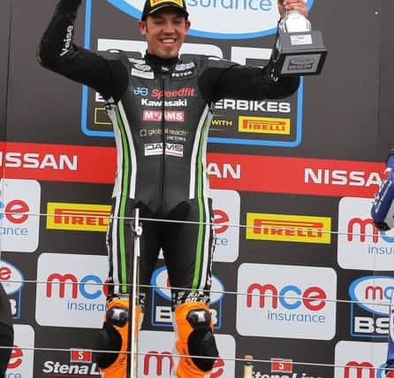 Peter Hickman on the winner's rostrum. Photo: Dave Yeomans