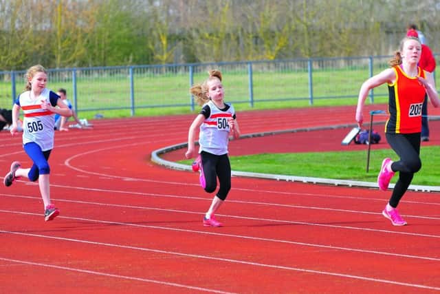 Freya Plaskitt and Bethany Ardern in the under 13 girls' 100m. Photo: Graham Stephenson. EMN-161104-164105002