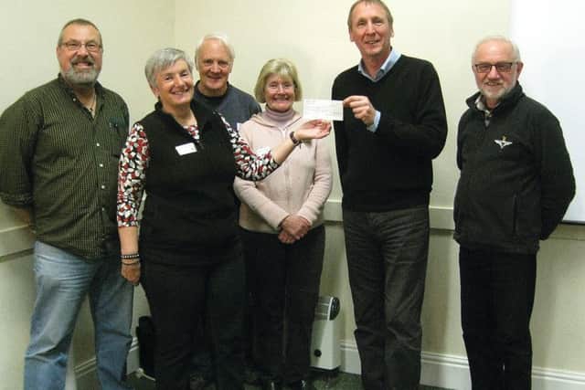 Dave Bromwich, of the Lincolnshire Wildlife Trust, receiving the cheque from Stef Round and the committee. Pictured (from left) are Phil Dixon, Stef Round, Mike Round, Barbara Chandler, Dave Bromwich and Denis Chandler.