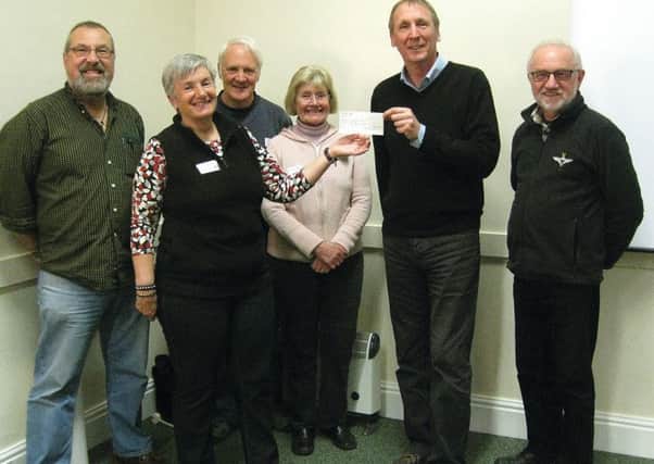Dave Bromwich, of the Lincolnshire Wildlife Trust, receiving the cheque from Stef Round and the committee. Pictured (from left) are Phil Dixon, Stef Round, Mike Round, Barbara Chandler, Dave Bromwich and Denis Chandler.
