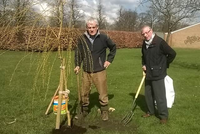 The willow tree being planted by Michael King, chairman of Billingborough Parish Council on the left, together with parish councillor Peter Pocock on the right. EMN-160414-145338001