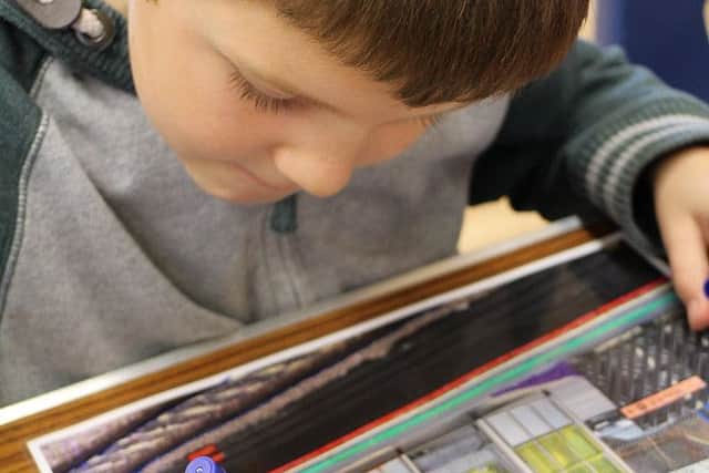 A youngster creates some artwork at Metheringham Wellbeing day