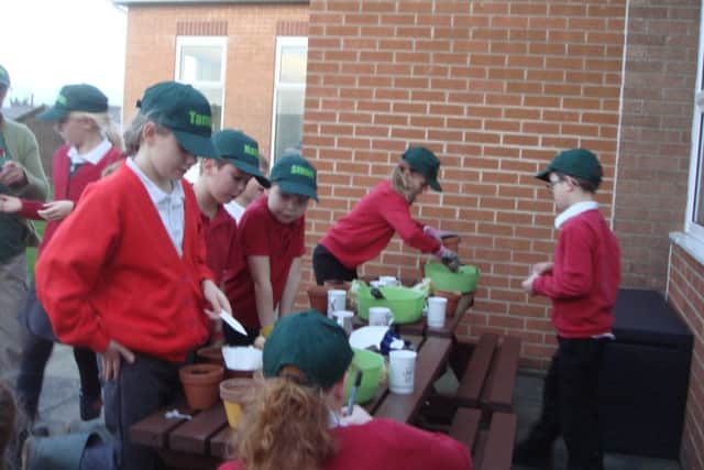 Children enjoy various activities at the garden club.