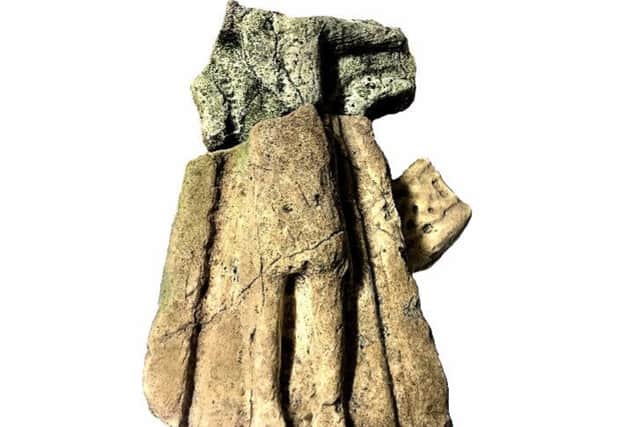 The fragments - made from the same limestone - clearly show the figure of Christ on the Cross.