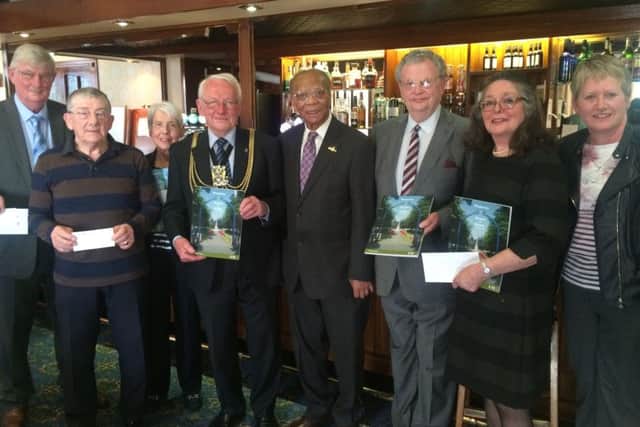 Ralph Ottey with Mayor of Boston Coun Richard Austin and publisher Dudley Bryant with representatives of each of the charities receiving money.