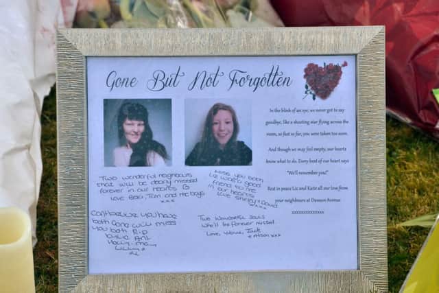 A tribute outside the house where Elizabeth Edwards and her 13-year-old daughter Katie were murdered. ANL-160417-115700001