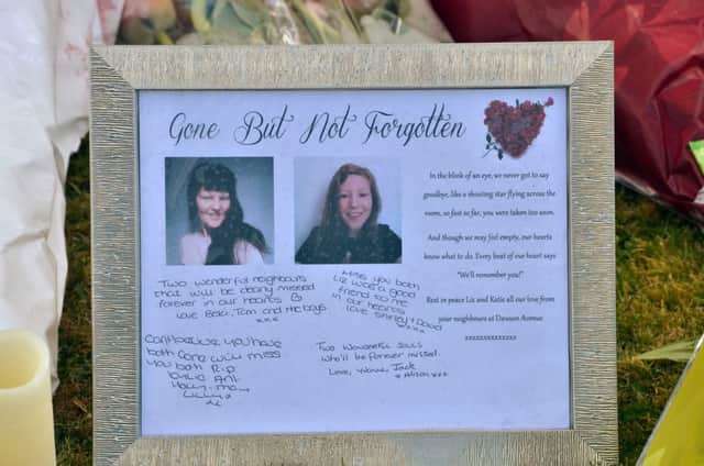 A tribute outside the house where Elizabeth Edwards and her 13-year-old daughter Katie were murdered. ANL-160417-115700001