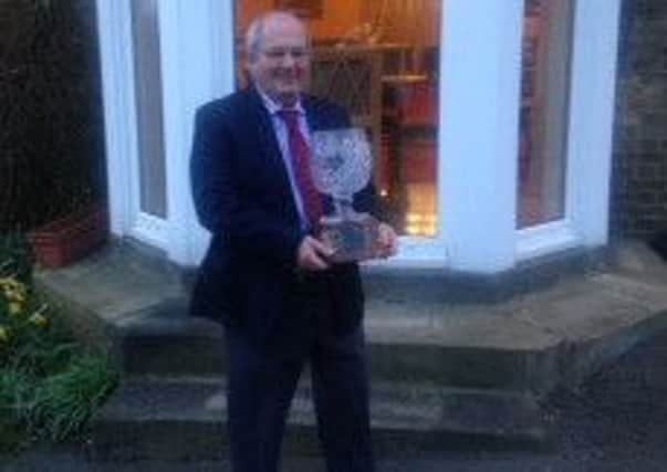 Lout Golf Club captain Mike Brader with the Town Challemge Trophy EMN-160418-122520002