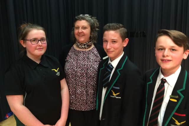 Poetry winners Jack Newrick, Luke Cowdroy and Tasha Borrett, with teacher Georgia Loryman EMN-160418-142312001