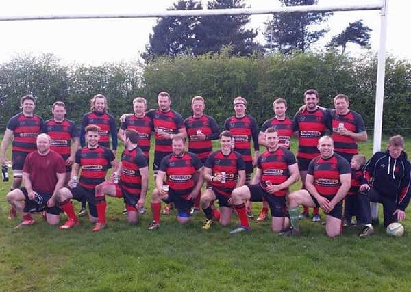 Sleaford first XV celebrate surviving the drop. hMAEAKMD36V1gk7bWZHA