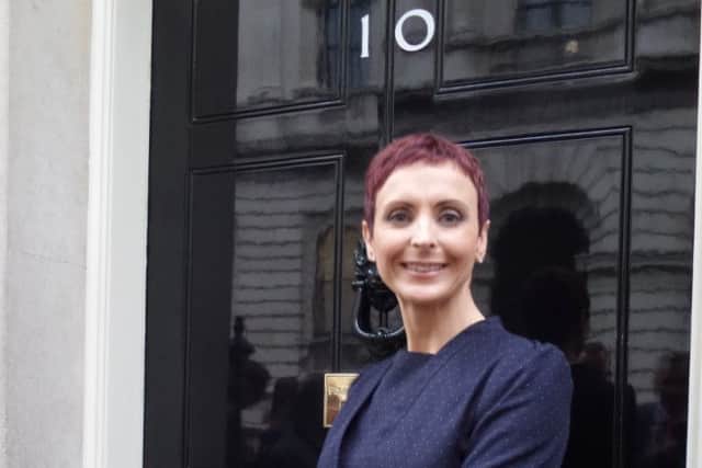 Kim Cinavas outside Number 10. EMN-160425-164238001