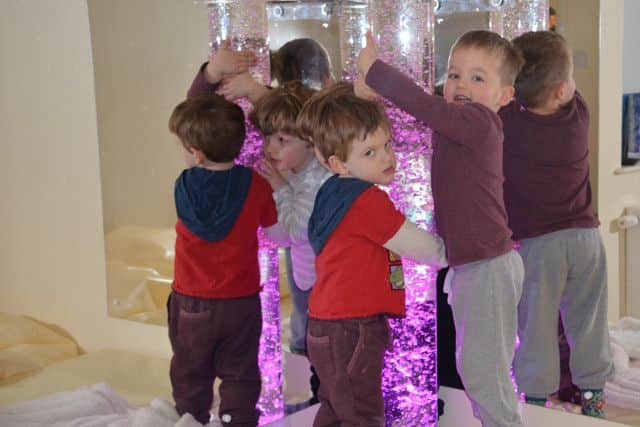 Thomas, Sam and Harrison playing in the new Sensory Room. EMN-160422-175027001