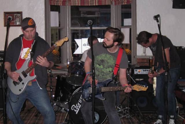 Glass Onion rocking out at the Beer and Bean. EMN-160421-123351001