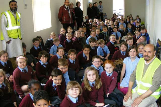 Members of the Sleaford Muslim Community Association, Noureddine Belazia and Albabul Islam, welcome William Alvey School pupils to their prayer hall. EMN-160422-164034001