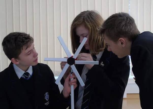 Students from Barnes Wallis work on the wind farm model EMN-160420-113011001