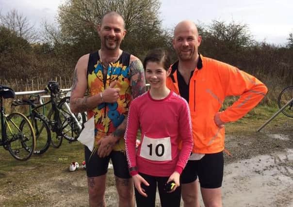 Carl Musson (left) with Phoebe and Guy Willey after the Go Tri competition EMN-160421-125606002