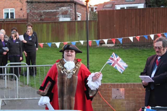 Mayor of Louth, Councillor Sue Locking, flies the flag.