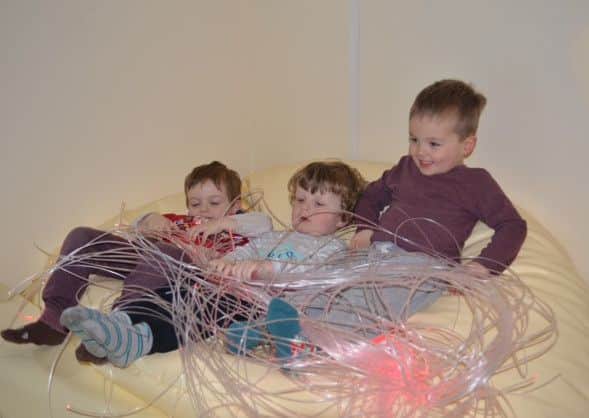 Thomas, Sam and Harrison playing in the new Sensory Room. EMN-160422-175003001