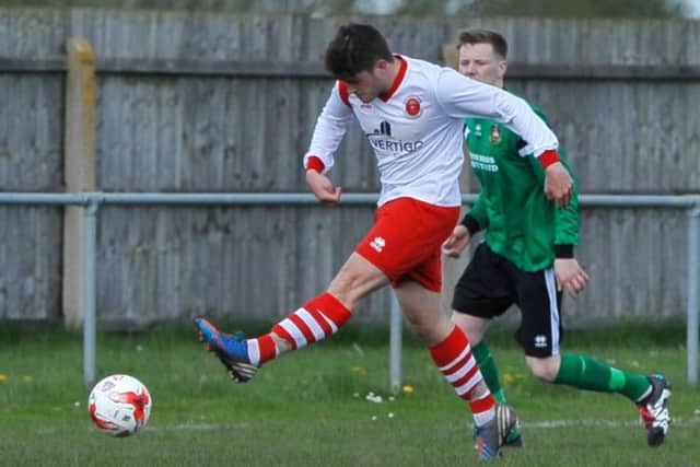 Courtney Warren fires goalwards.