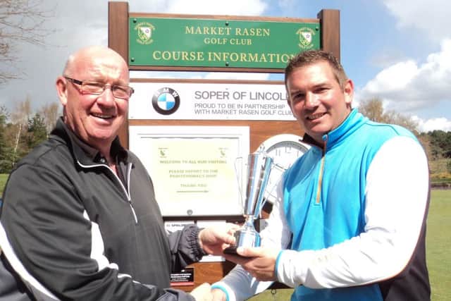 Market Rasen Golf Club chairman Colin Law presents the Duckworth Trophy to its inaugural winner Trevor Lowe EMN-160425-170931002