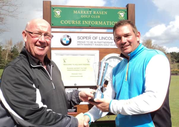 Market Rasen Golf Club chairman Colin Law presents the Duckworth Trophy to its inaugural winner Trevor Lowe EMN-160425-170931002