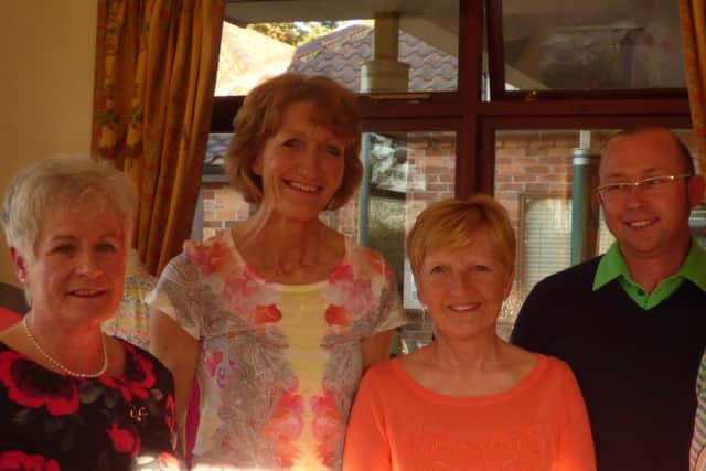 Captain Helen Grinham (left) and team receive their prize from club professional Joel Cant EMN-160426-093445002