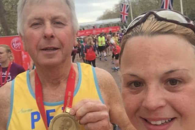 Dad Pete Cotton and daughter Tracy Gostelow after completing the London Marathon EMN-160426-153650001