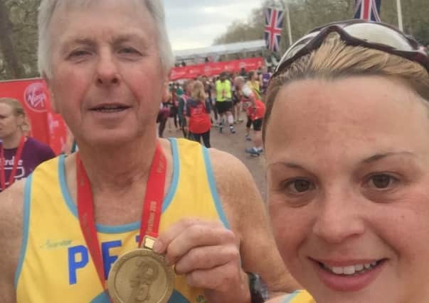 Dad Pete Cotton and daughter Tracy Gostelow after completing the London Marathon EMN-160426-153650001