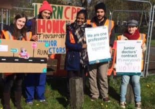 Junior doctors outside Pilgrim Hospital in Boston. ANL-160427-134153001