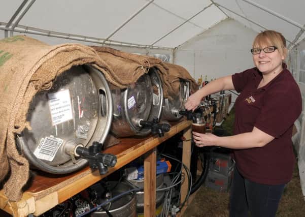 Beer Festival at The Bull, Rippinghale. Sam Mumby working behind the bar. EMN-160425-140602001