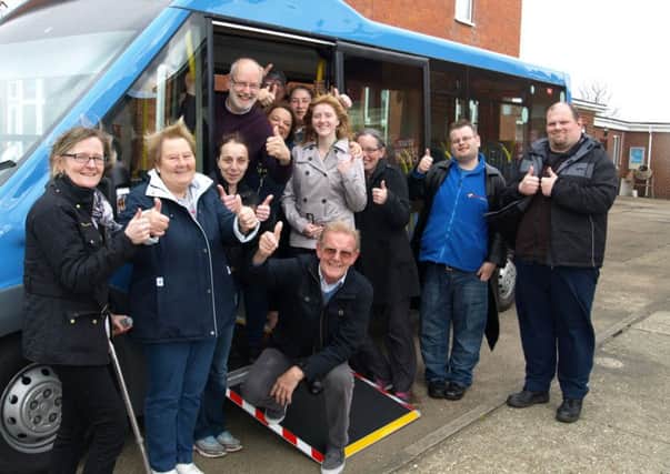 Community members at Hope House celebrate the arrival of the new bus. Inset: These local ladies get a tour round the new bus.