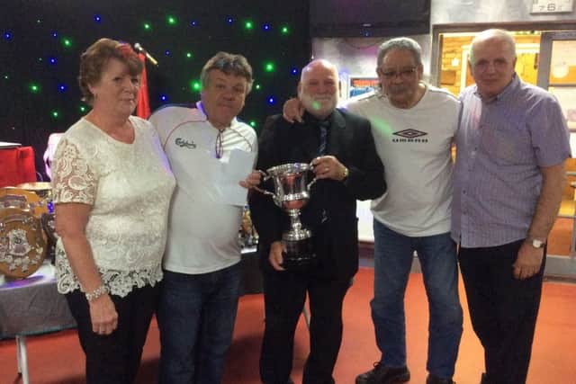 Division One winners Ex Service U Watts - S. Malpass, D. Malpass, F. Kaho and S. Godber - collect their prize.