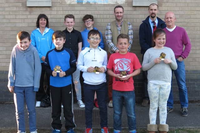 The tennis winners line up.