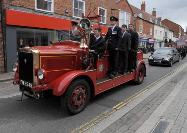 Former Sleaford fireman, Bill Ullyatt's funeral, saw him conveyed on board an old fire engine and receive a guard of honour by Sleaford firefighters. EMN-160305-114307001