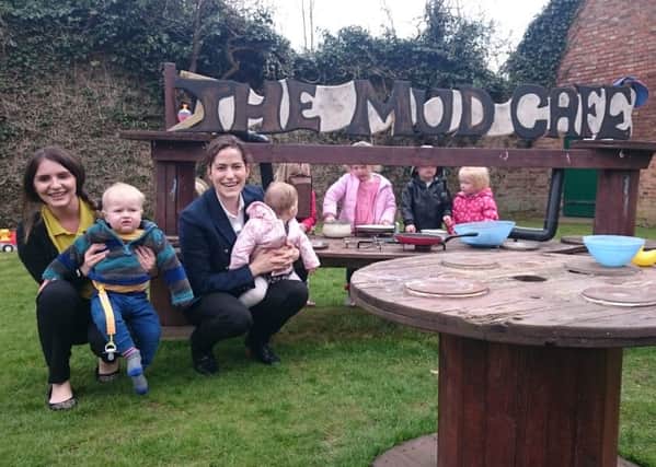 Victoria Atkins with staff and youngsters at Bearhugs Nursery EMN-160305-160952001