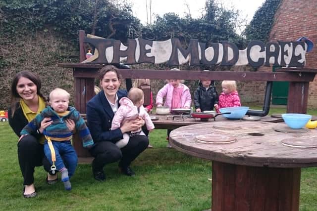 Victoria Atkins with staff and youngsters at Bearhugs Nursery EMN-160305-160952001